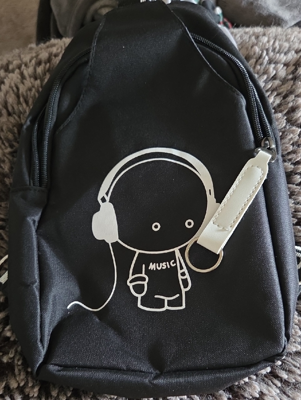 Black Crossbody Bag with White Music Character Graphic